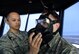 U.S. Air Force Tech. Sgt. Brandon Longmire, air traffic controller assigned to the 8th Operations Squadron inspects the"pig snout" on Staff Sgt. Brandon White's Avon M50 gas mask at Kunsan Air Base, Republic of Korea, April 26, 2018. The pig snout consists of a small voice transmitter within the gas mask and a dteachable tranmitter on the outside to project one's voice to communicate with increased clarity. (U.S. Air Force photo by Staff Sgt. Jasmonet D. Jackson)