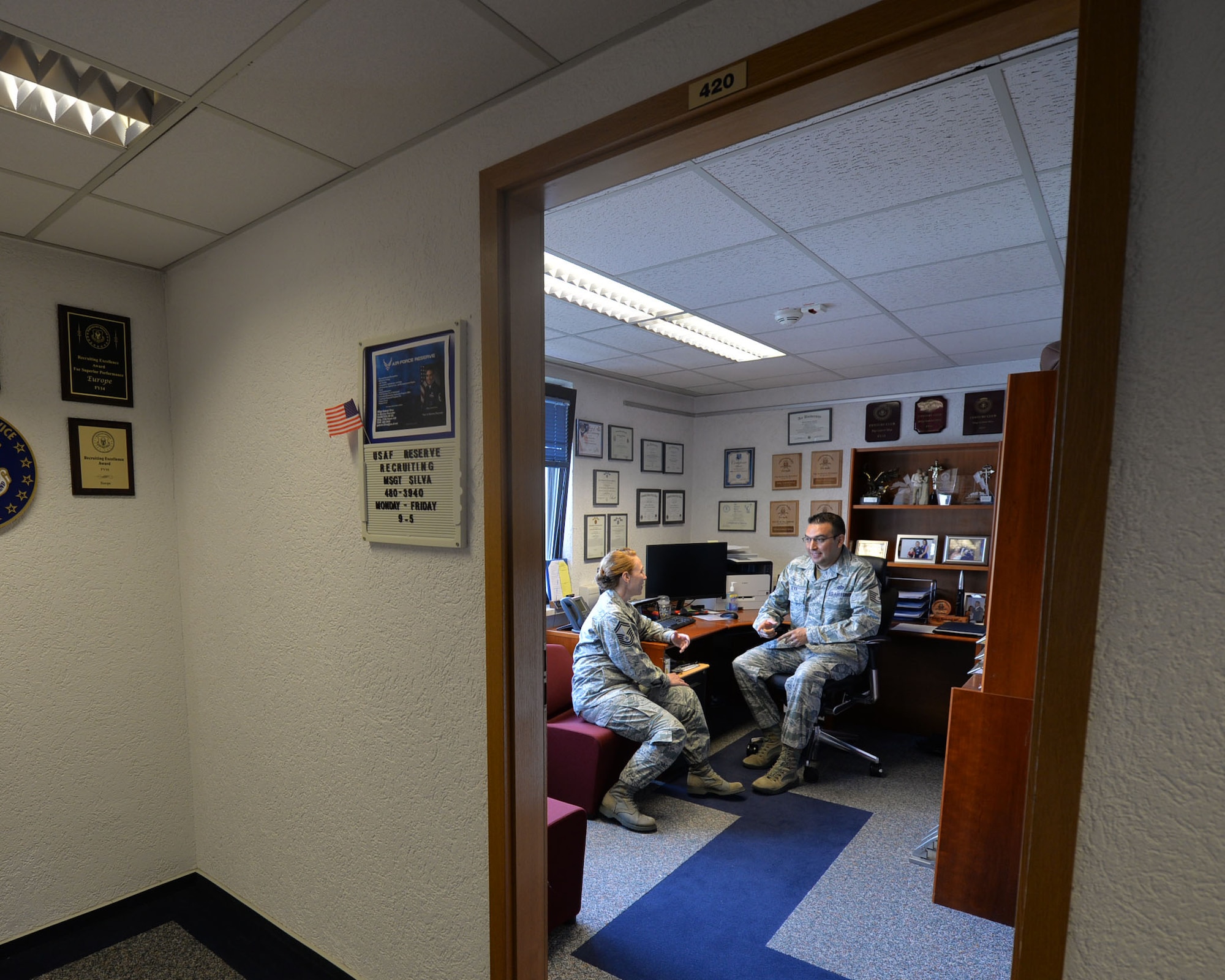Ramstein’s Air Force Reserve Recruiting Team, Senior Master Sgt. Julie Boekers and Master Sgt. Gabriel Silva, discuss they day’s operations in their office on Ramstein Air Base, April 24, 2018. The Air Force Reserve offers currently serving, Active-Duty Airmen (enlisted and officer) the opportunity to transfer into the Reserve via two programs – Palace Front and Palace Chase. (U.S. Air Force photo by Staff Sgt. Tory Patterson)