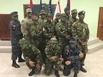 Louisiana National Guard Kenrick Cormier, second from left, back row, stands with his fellow graduates from the Belize Defence Force’s Jungle Warfare Instructor Course in Belize. Cormier was the first Guardsman to participate in the course.