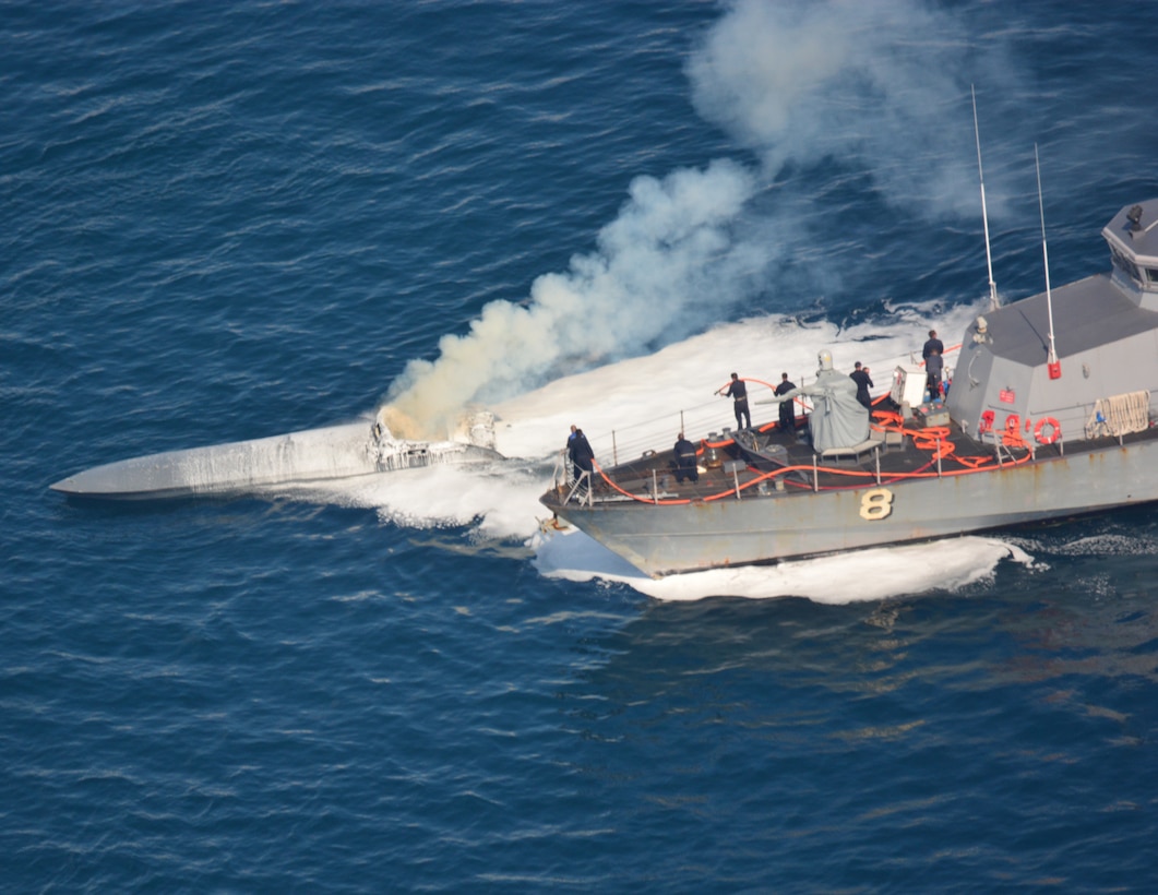 USS Zephyr conducts ship-to-ship firefighting to extinguish a fire aboard a low-profile go-fast drug vessel.