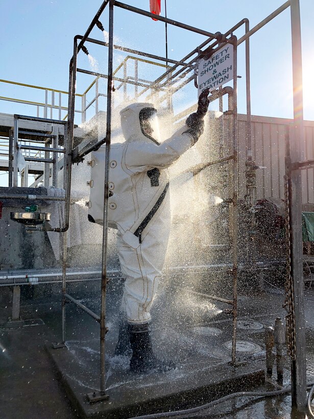 Workers wear hazardous materials suits and follow decontamination procedures around dinitrogen tetroxide or hydrazine at the Hypergol Storage Facility on Vandenberg Air Force Base, California. Hypergolic propellants spontaneously ignite when they come into contact with each other.