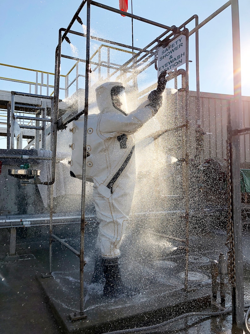 Workers wear hazardous materials suits and follow decontamination procedures around dinitrogen tetroxide or hydrazine at the Hypergol Storage Facility on Vandenberg Air Force Base, California. Hypergolic propellants spontaneously ignite when they come into contact with each other.