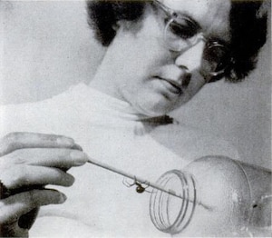 Armada Ruffner, director of Columbus Quartermaster Depot’s spiderweb production shop, coaxes a black widow from its jar. Ruffner harvested silk from the deadly spiders for use in gun sights and compasses.