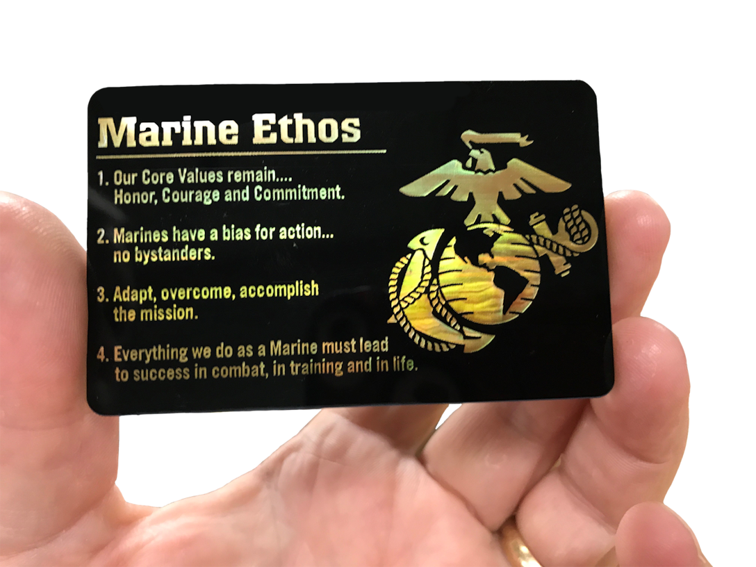 Monochromatic specialty printing gives the Marine Corps Eagle, Globe and Anchor on the plastic card a gold pearl effect.