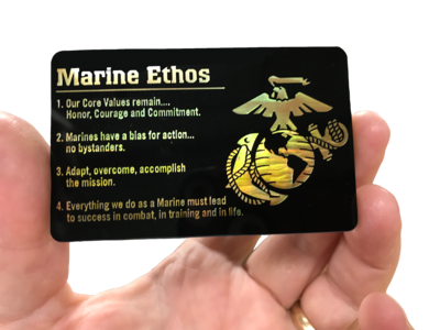 Monochromatic specialty printing gives the Marine Corps Eagle, Globe and Anchor on the plastic card a gold pearl effect.