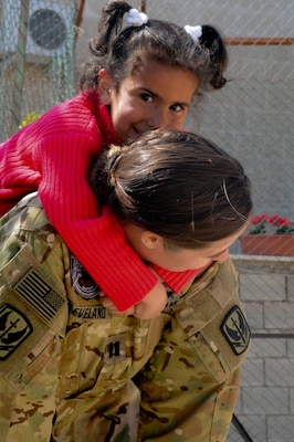 A U.S. Soldier gives a resident of the Amman SOS Children’s Village a piggyback April, 23. The Soldier was part of a donation visit to the village that was arranged by Jordan Armed Forces Imams in coordination with U.S. Chaplains as part of ongoing coordination between the two partner nation militaries. Events like these help to build trust between service members and citizens of different nations.