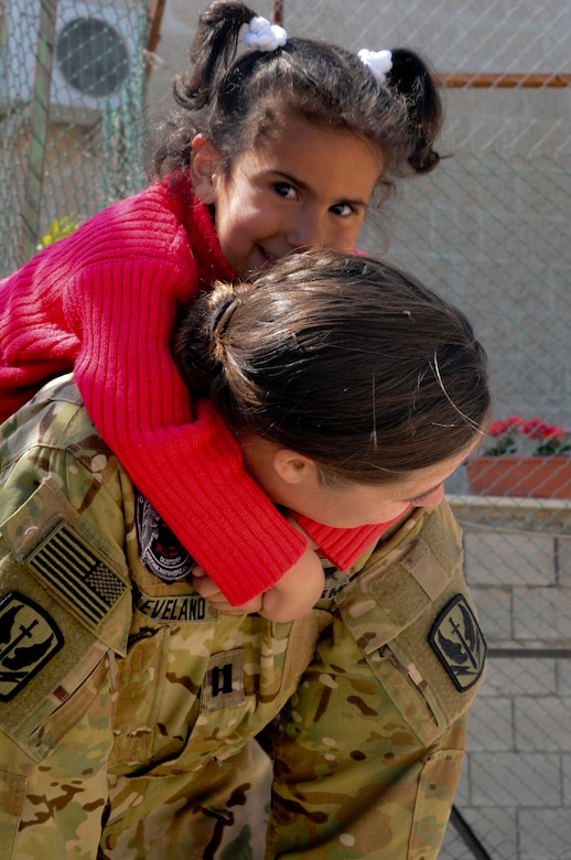 A U.S. Soldier gives a resident of the Amman SOS Children’s Village a piggyback April, 23. The Soldier was part of a donation visit to the village that was arranged by Jordan Armed Forces Imams in coordination with U.S. Chaplains as part of ongoing coordination between the two partner nation militaries. Events like these help to build trust between service members and citizens of different nations.