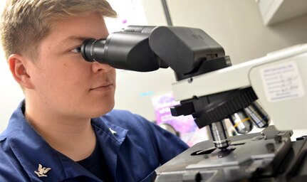 Navy Hospital Corpsman 3rd Class Robert Hall studies a blood sample with a microscope at Naval Branch Health Clinic Kings Bay’s laboratory. Blood tests and pap smears are commonly used ways to diagnose sexually transmitted infections.