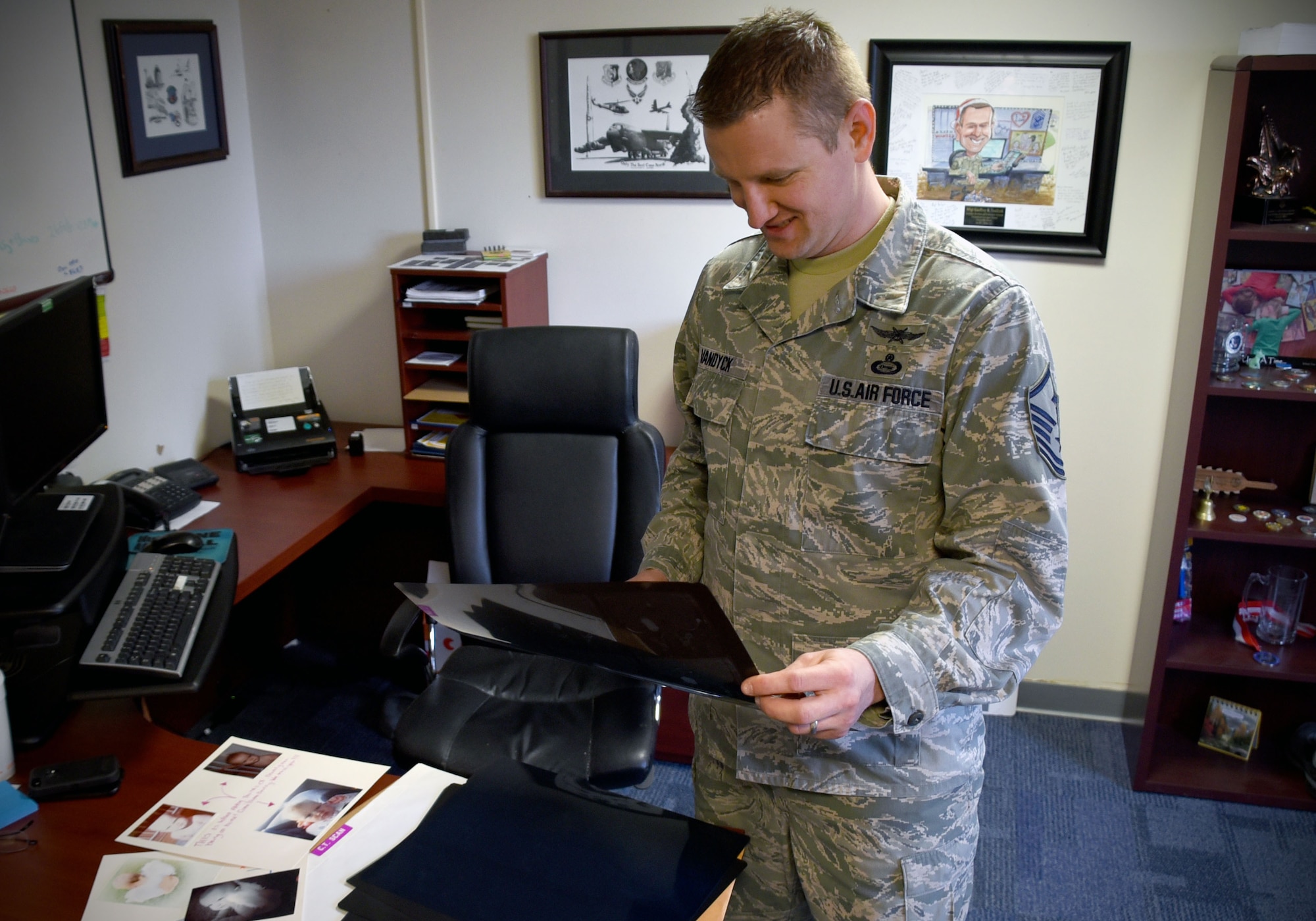 Master Sgt. Geoffrey VanDyck, 707th Force Support Squadron first sergeant, views an image of the tumor found on his auditory nerve. In May 2005, VanDyck was diagnosed with acoustic neuroma, a noncancerous, normally slow growing tumor that develops on the main vestibular nerve that leads from the inner ear to the brain. (U.S. Air Force photo by Tech. Sgt. Veronica Pierce)