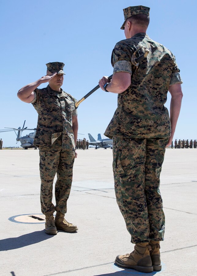 Sgt. Maj. Peter A. Siaw, left, assumes his post as the 3rd Marine Aircraft Wing sergeant major during a relief and appointment ceremony at Marine Corps Air Station Miramar, Calif., April 20. Siaw replaced Sgt. Maj. James K. Porterfield, who served as the sergeant major since May 2016. (U.S. Marine Corps photo by Lance Cpl. Clare McIntire)
