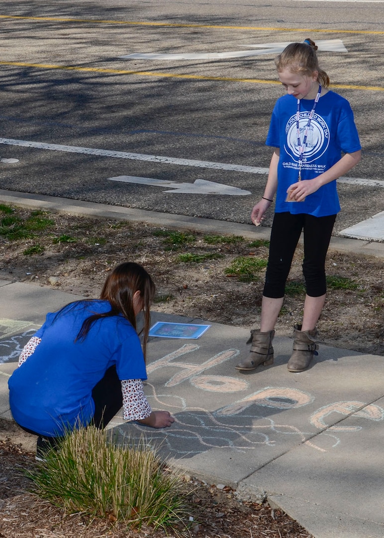 Participants in Bring Your Child to Work Day create messages to promote awareness and prevention for bullying and other abuse.