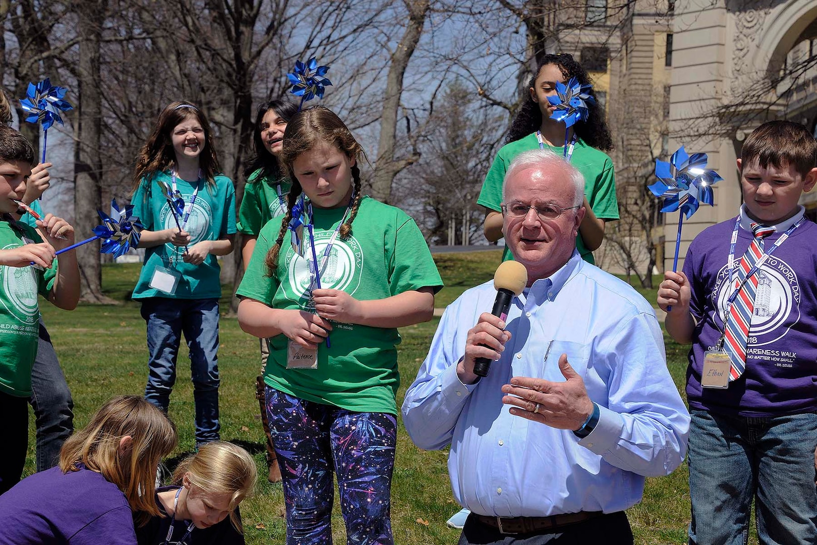 Battle Creek Mayor Mark Behnke joins with other walkers to get the Walk for Child Abuse Awareness started.