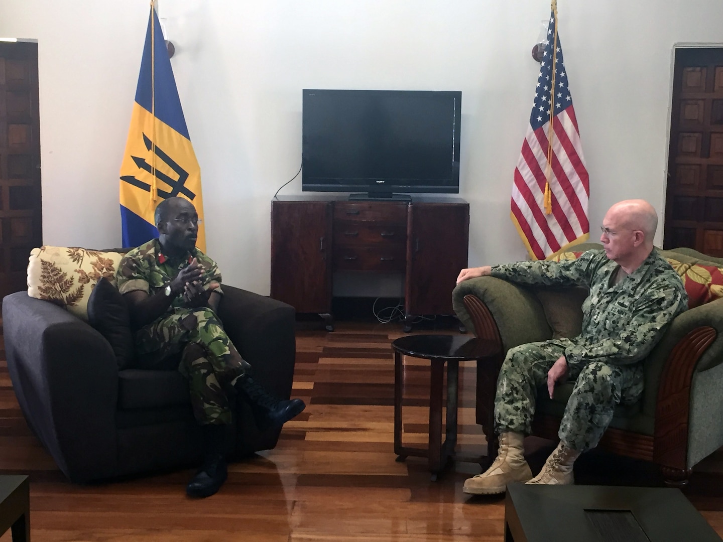 Adm. Kurt W. Tidd talks with Chief of Staff Barbados Defence Force Col. Glyne Grannum.