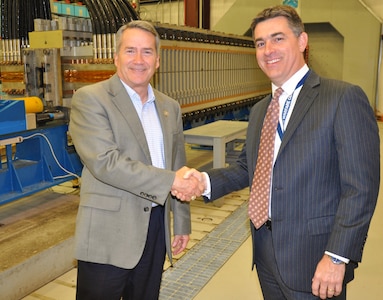 IMAGE: DAHLGREN, Va. (April 24, 2018) - U.S. Rep. Jody Hice, (R-Ga.), shakes hand with Dale Sisson, Naval Surface Warfare Center Dahlgren Division (NSWCDD) deputy technical director, moments after Sisson presented Hice with the NSWCDD Centennial Coin in commemoration of the command's 100 years of research and development accomplishments. Throughout his tour of NSWCDD facilities, Hice saw the command's capability to develop and integrate complex warfare systems, including the ability to incorporate electric weapons technology into existing and future fighting forces and platforms. The official opening of business for Dahlgren began with the firing of the 7" Tractor Gun on October 16, 1918.  Since June 1918, when President Woodrow Wilson signed a proclamation to acquire nearly one thousand acres to create the original ordnance proving ground during World War I, through today, Dahlgren has served as the center for the scientific research and development that led to hundreds of patents, innovations, and scientific breakthroughs for the U.S. Navy. Each week, NSWCDD posts new content for the public to learn more about the many people, places, and amazing projects that the command and this base has produced over the last century: http://www.navsea.navy.mil/Home/Warfare-Centers/NSWC-Dahlgren/Dahlgren_Centennial/.  (U.S. Navy photo by John Joyce/Released)