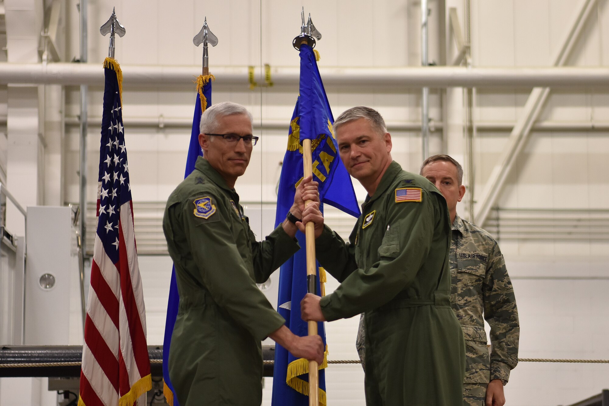 Maj. Gen. Craig L. La Fave, 22nd Air Force commander, accepts the guidon from 911th Airlift Wing Commander Col. Douglas N. Strawbridge during a change of Numbered Air Force ceremony at the Pittsburgh International Airport Air Reserve Station, Pennsylvania, April 6, 2018. The 911th AW transitioned from 22nd Air Force to 4th Air Force to align with its changing mission set. (U.S. Air Force photo by Staff Sgt. Marjorie A. Bowlden)