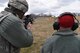 A 911th Security Forces Squadron combat arms training and maintenance instructor, right, observes a 911th SFS member, left, during M203 grenade launcher firing in Burgettstown, Pa., April 8, 2018. The M203 is a single shot 40mm grenade launcher designed to attach to an M-4 Weapon system. (U.S. Air Force photo by Staff Sgt. Marjorie Bowlden)