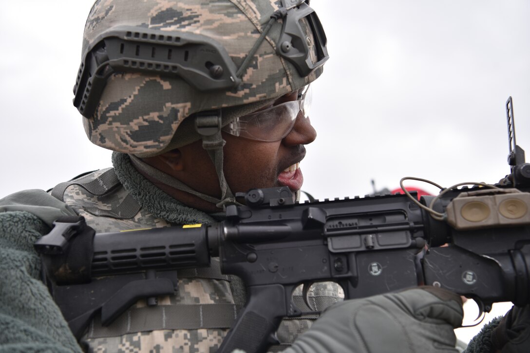 Staff Sgt. Kellan Harris, a fire team leader with the 911th Security Forces Squadron, aims his weapon downrange during M203 grenade launcher training in Burgettstown, Pa., April 8, 2018. The M203 is a single shot 40mm grenade launcher designed to attach to an M-4 Weapon system. (U.S. Air Force photo by Staff Sgt. Marjorie Bowlden)