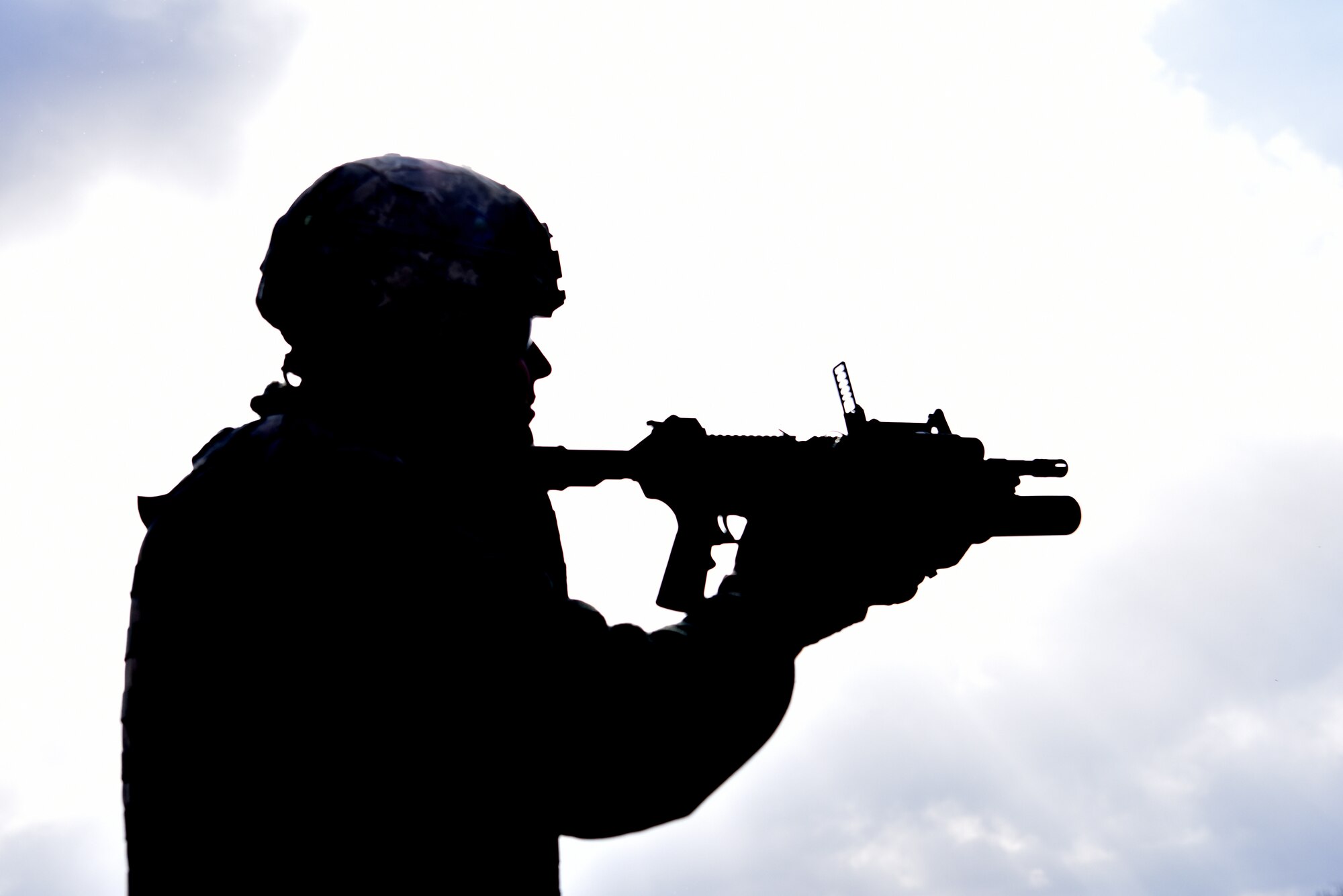 Tech. Sgt. Dylan Schrack, a fire team leader with the 911th Security Forces Squadron, aims his weapon downrange during M203 grenade launcher training in Burgettstown, Pennsylvania, April 8, 2018. The M203 is a single shot 40mm grenade launcher designed to attach to an M-4 Weapon system. (U.S. Air Force photo by Staff Sgt. Marjorie Bowlden)