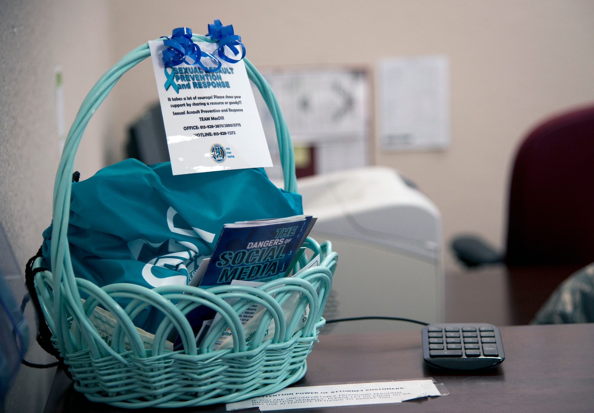 Baskets with Sexual Assault Prevention and Response informational handouts are present at all the helping agencies on MacDill Air Force Base, Fla., April 27, 2018.