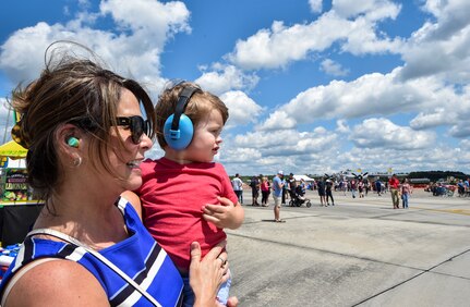Spectators watch an aerial act at the Air & Space Expo rehearsal at Joint Base Charleston, S.C., April 27, 2018.