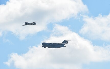 A C-47 Skytrain and a C-17 Globemaster III fly during a heritage flight at the 2018 Air and Space Expo rehearsal at Joint Base Charleston, S.C., April 27, 2018.