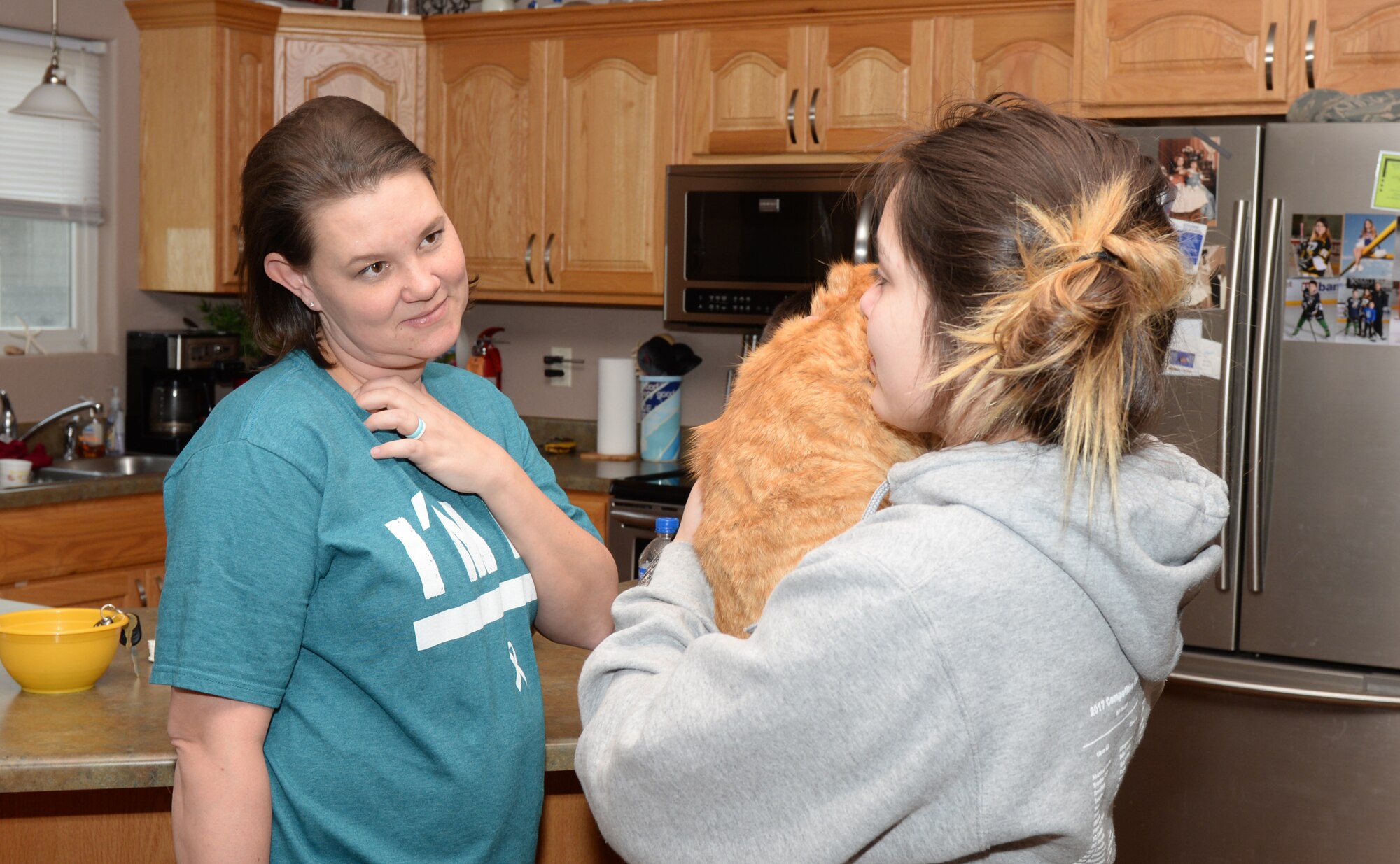 Tech. Sgt. Leah Thomas, noncommissioned officer in charge of Quality Assurance, Aircrew Flight Equipment talks to her daughter at their home in Box Elder, S.D., April 19, 2018. The Thomas’ have fostered children and adopted one of their previous foster children. (U.S. Air Force photo by Airman 1st Class Nicolas Z. Erwin)