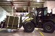 U.S. Air Force Airman 1st Class Tyler Neff, a member of the 509th Logistics Readiness Squadron, transfers weapons with a 10K-AT forklift driver at Whiteman Air Force Base, Mo., Jan. 13, 2018, in support of a 442d Fighter Wing deployment. The 509th and 131st work together to ensure missions, such as deployments and humanitarian efforts, are successful. (U.S. Air Force photo by Staff Sgt. Danielle Quilla)