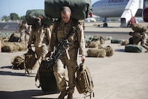 U.S. Marines and Sailors with Marine Rotational Force – Darwin 2018 collect their luggage and proceed to customs after arriving at the Royal Australian Air Force Base Darwin, Australia.