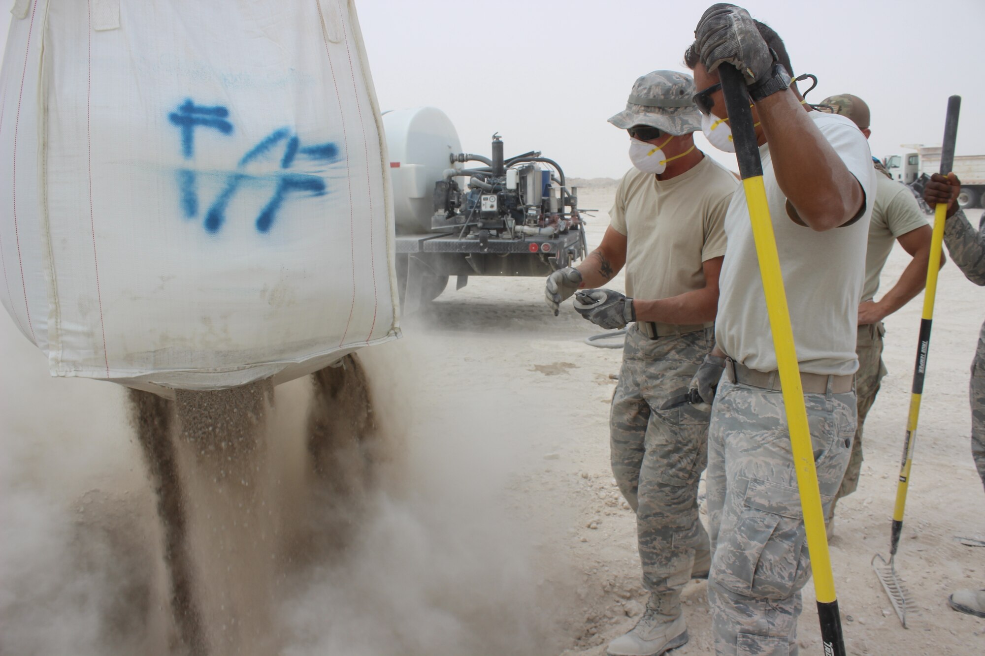 Dry concrete transported by a telehandler is placed into a crater on a mock damaged airfield at Al Udeid Air Base, Qatar on April 25, 2018. The machinery is part of an arsenal of new equipment civil engineers use for backfilling and capping craters as part of Rapid Airfield Damage Recovery (RADR). Civil engineers can now guarantee repairs to full operational capability in a matter of hours. This is also the first time RADR has been utilized in AFCENT. (U.S. Air Force photo by Tech. Sgt. Arthur Mondale Wright)