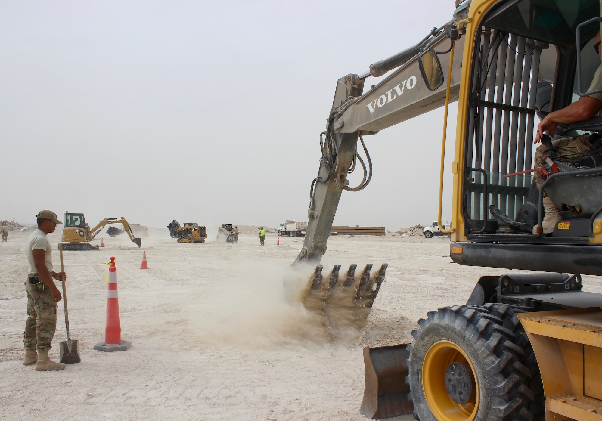 Members of the 379th Expeditionary Civil Engineer Squadron excavate a crater on a mock runway at Al Udeid Air Base, Qatar on April 25, 2018. Civil engineers were exercised on Rapid Airfield Damage Recovery (RADR), a new process to rapidly repair damaged airfields. Civil engineers can now guarantee repairs to full operational capability in a matter of hours. This is also the first time RADR has been utilized in AFCENT. (U.S. Air Force photo by Tech. Sgt. Arthur Mondale Wright)