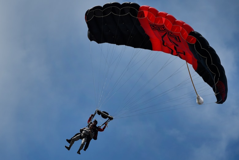 U.S. Army Sgt. 1st Class Aaron Figel, U.S. Army Special Operations Command Parachute Demonstration Team, known as the “Black Daggers,” performs a tandem jump with U.S. Air Force Master Sgt. Michael Howell, 437th Aerial Port Squadron, as part of a 2018 Air and Space Expo rehearsal April 27, 2018, at Joint Base Charleston, S.C.