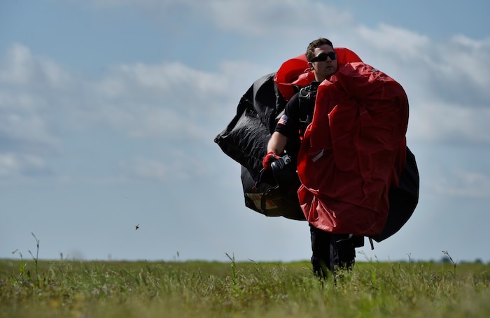 U.S. Army Staff Sgt. Steve Travers, U.S. Army Special Operations Command Parachute Demonstration Team, known as the “Black Daggers,” completes a practice jump as part of a 2018 Air and Space Expo rehearsal April 27, 2018, at Joint Base Charleston, S.C.