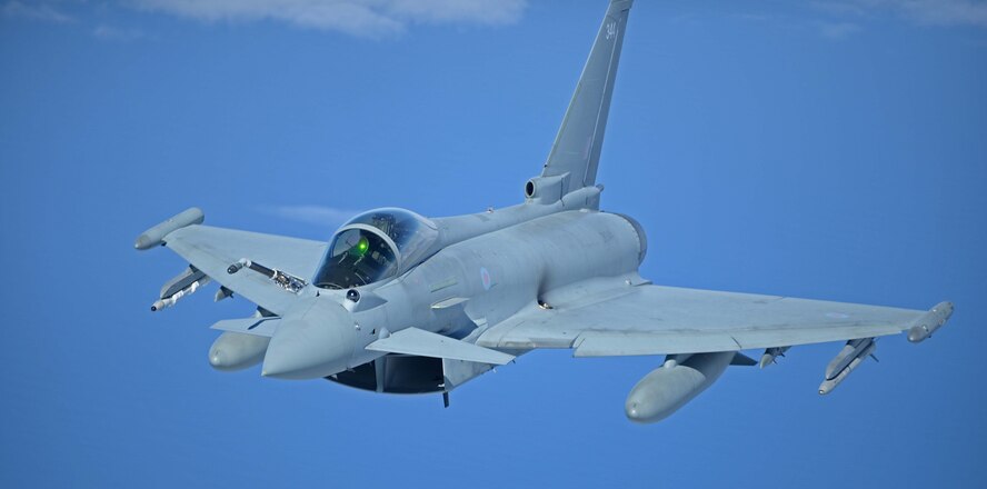 A Royal Air Force Typhoon flies behind a U.S. Air Force KC-135 Stratotanker during U.K.-led Exercise Joint Warrior over England, April 25, 2018. Exercise Joint Warrior is Europe’s largest military exercise that involved U.K., NATO and allied units. (U.S. Air Force photo by Senior Airman Luke Milano)