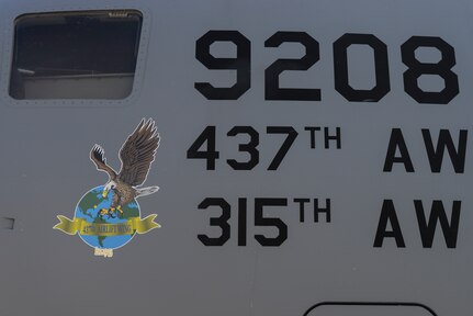 A Team Charleston C-17 Globemaster III sits with a new nose art decal here at Joint Base Charleston, S.C., April 26, 2018. A Nose Art Unveiling Ceremony was held April 27 for two of Charleston's C-17s in conjunction with the JB Charleston Air and Space Expo rehearsal.
