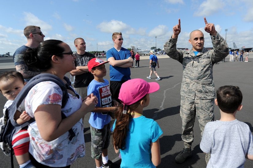 Master Sgt. Michael Howell, 437th Aerial Port Squadron, NCO in charge of the command section, tells his family and friends about his experience tandem jumping with the U.S. Army Special Operations Command Daggers Parachute Demonstration Team during the 2018 Air and Space Expo rehearsal April 27, 2018.