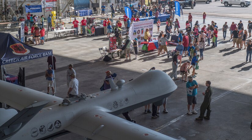 Attendees visit multiple exibits during the Joint Base Charleston Air and Space Expo at JB Charleston, S.C.  Apr 28, 2018.