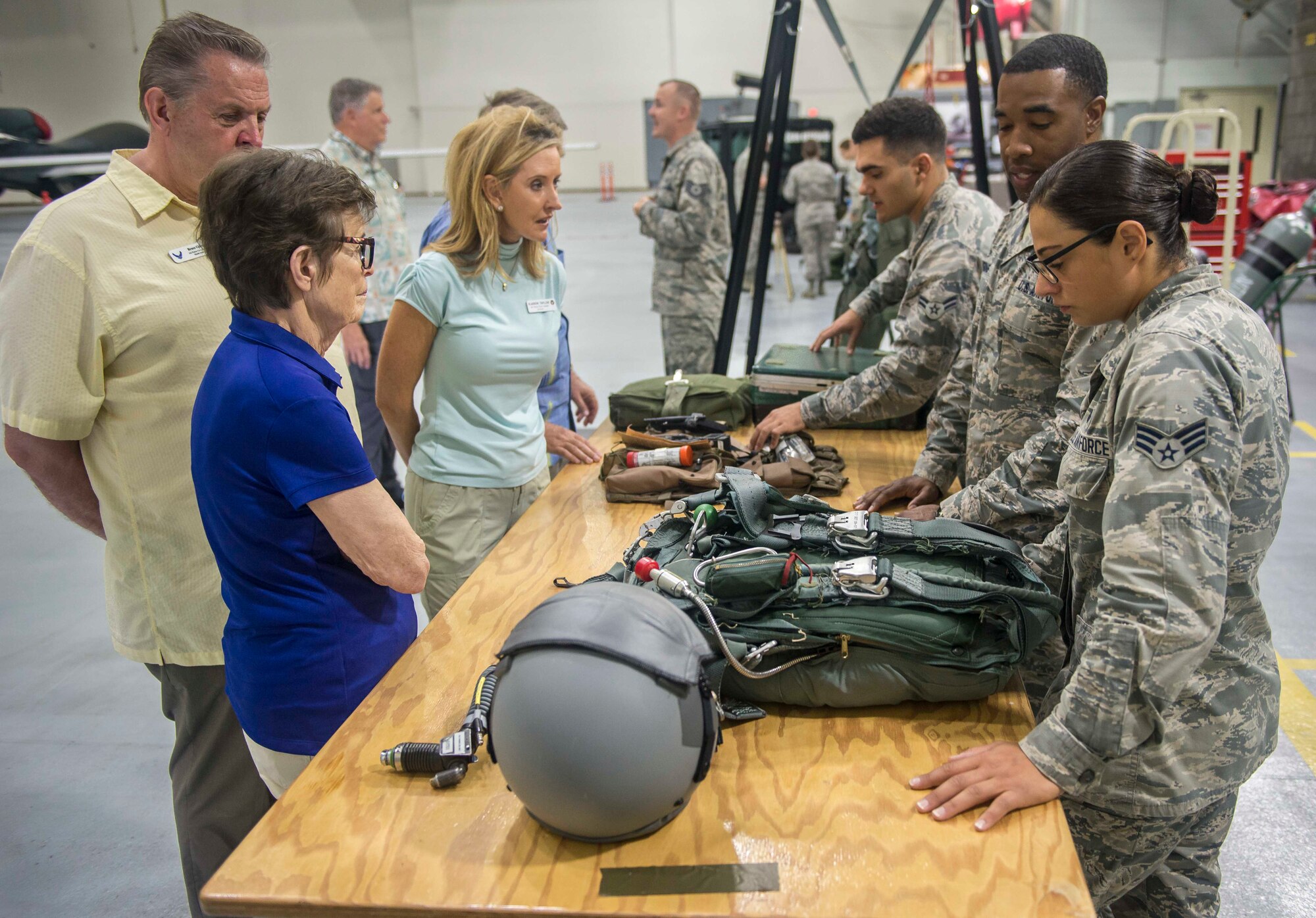 Airmen from the 20th Expeditionary Bomb Squadron brief a group of Air Force civic leaders in a hangar on Andersen Air Force Base, Guam, April 28, 2018. Air Force civic leaders are unpaid advisers, key communicators and advocates for the Air Force. (U.S. Air Force photo by Airman 1st Class Christopher Quail)