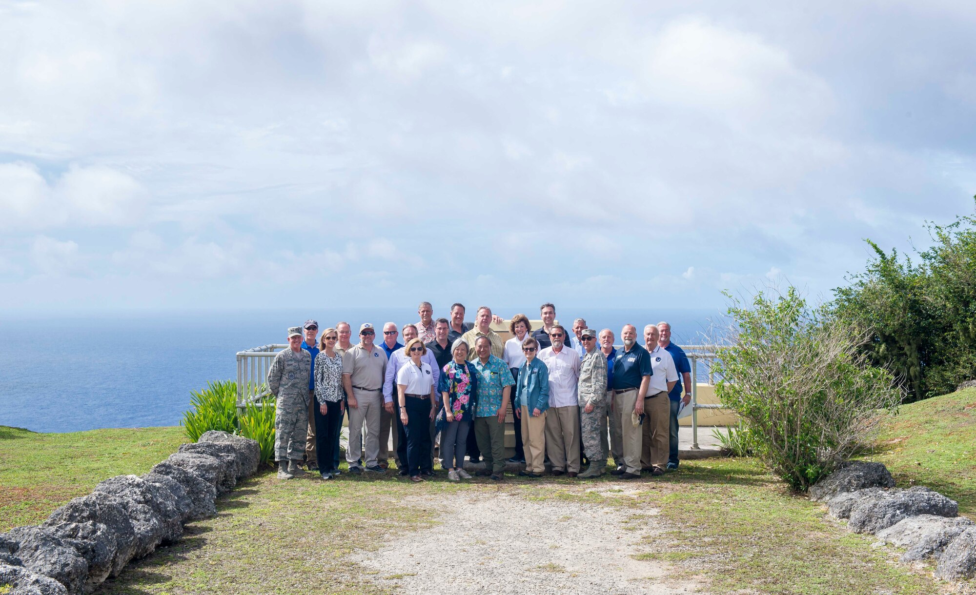 Vice Chief of Staff of the U.S. Air Force Gen. Stephen Wilson and more than 20 select civic pose for a photo during a base tour April 27, 2018, at Andersen Air Force Base, Guam. The tour allowed the civic leaders to view a new perspective of the military missions on island by getting a behind-the-scenes look into workcenters and flightline operations. (U.S. Air Force photo by Airman 1st Class Christopher Quail)