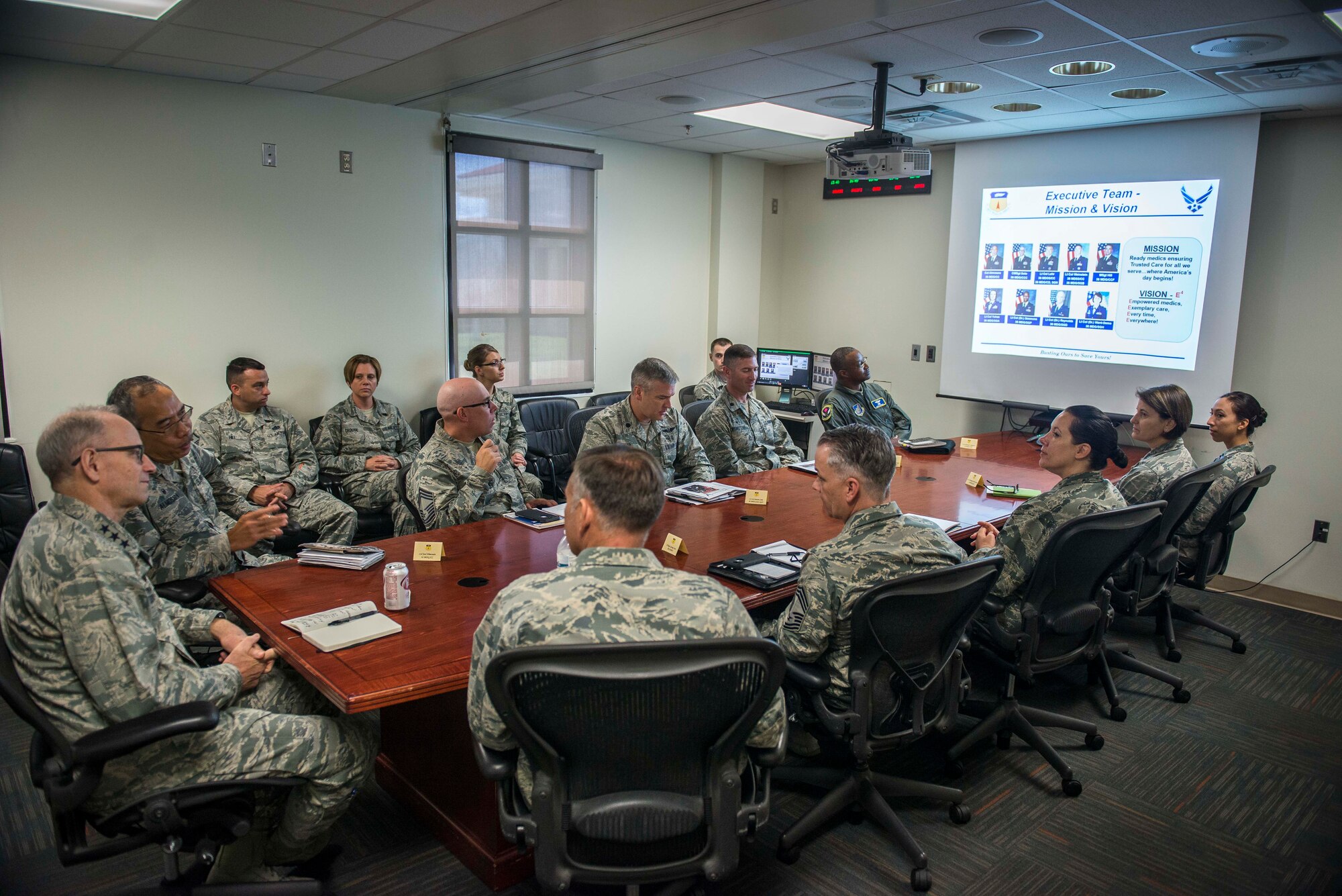 Leadership from the 36th Medical Group squadron briefs U.S. Air Force Lt. Gen Mark A. Ediger, Surgeon General of the Air Force, during his visit April 17, 2018, to Andersen Air Force Base, Guam. Leadership discuss some of the unique aspects of running a medical squadron on an island distant away. (U.S. Air Force Photo by Airman 1st Class Christopher Quail)