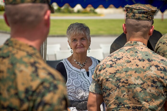 “We are very honored to know that he is not forgotten, and to know the Marines remember him,” said Joe Braunschweig (center), nephew of Medal of Honor recipient Cpl. Louis J. Hauge Jr. Combat Logistics Regiment 35, 3rd Marine Logistics Group, dedicated their headquarters building in memory of Hauge for his heroic actions during the Battle of Okinawa, April 30, 2018 on Camp Kinser, Okinawa, Japan. Braunschweig is a native of Brownspoint, Washington. (U.S. Marine Corps photo by Lance Cpl. Jamin M. Powell)