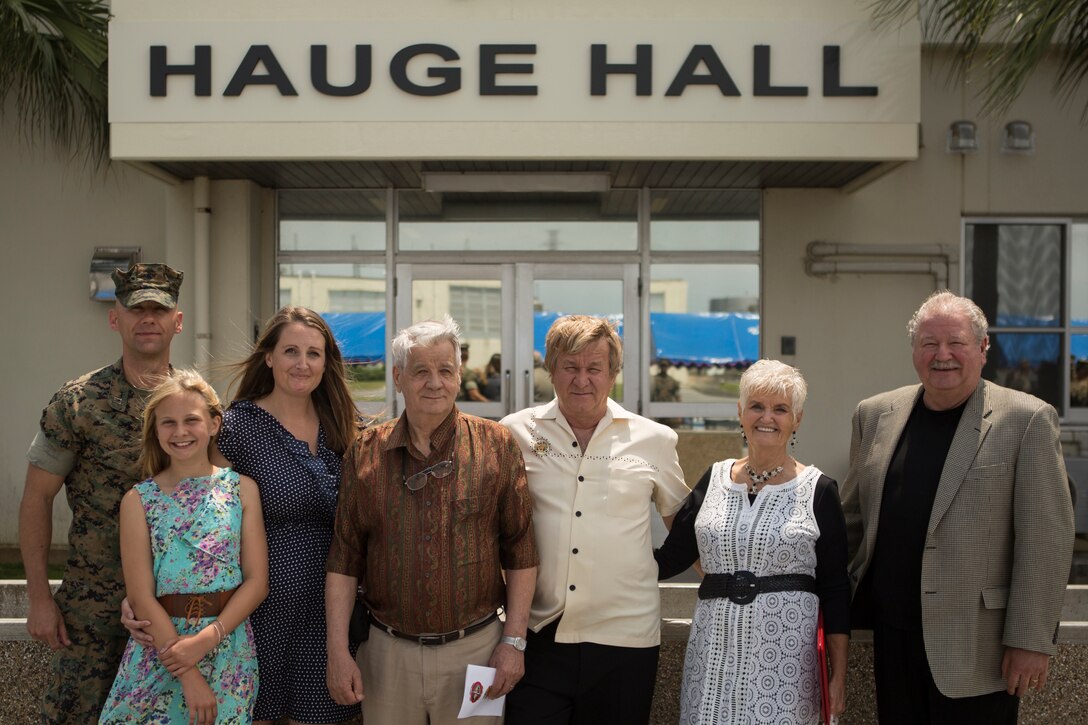 “We are very honored to know that he is not forgotten, and to know the Marines remember him,” said Joe Braunschweig (center), nephew of Medal of Honor recipient Cpl. Louis J. Hauge Jr. Combat Logistics Regiment 35, 3rd Marine Logistics Group, dedicated their headquarters building in memory of Hauge for his heroic actions during the Battle of Okinawa, April 30, 2018 on Camp Kinser, Okinawa, Japan. Braunschweig is a native of Brownspoint, Washington. (U.S. Marine Corps photo by Lance Cpl. Jamin M. Powell)