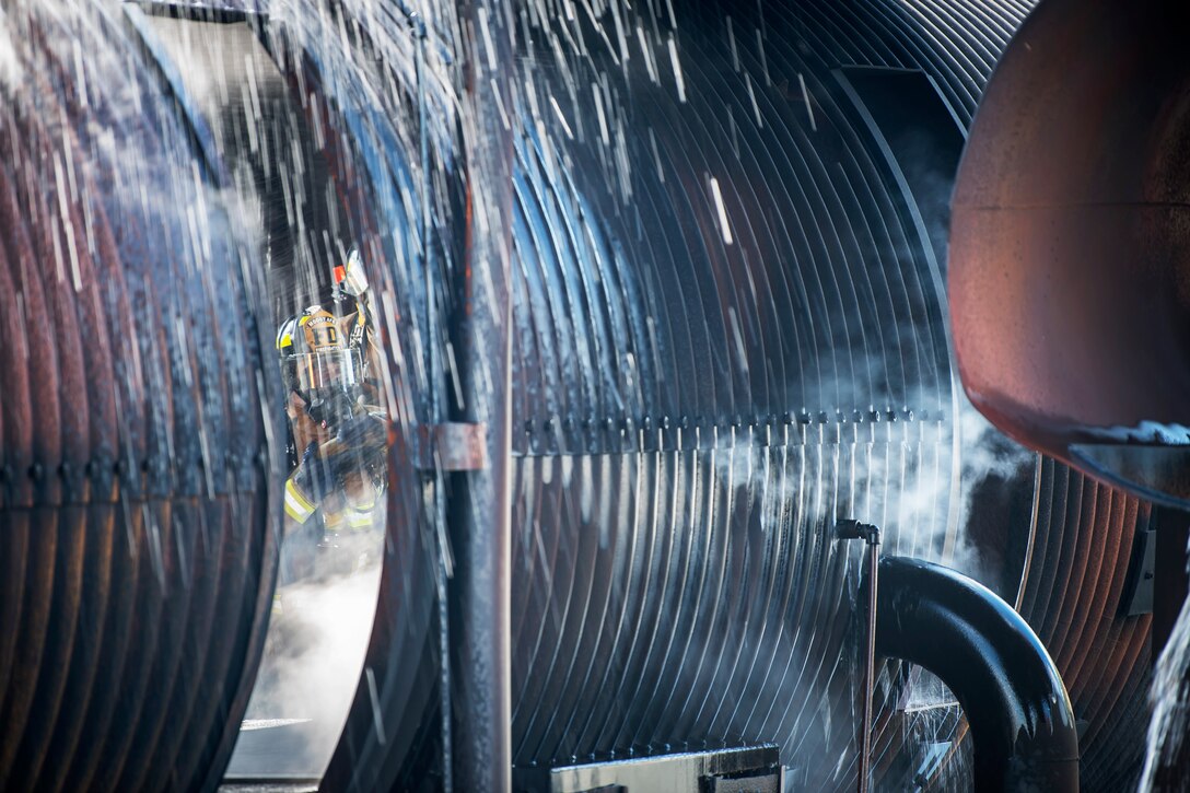A firefighter from the 23d Civil Engineer Squadron (CES) extinguishes an aircraft fire during live-fire training, April 24, 2018, at Moody Air Force Base, Ga.  Firefighters from the 23d CES and Valdosta Fire Department participated in the training to gain more experience fighting aircraft fires and to work together as a cohesive team while still practicing proper and safe firefighting techniques. (U.S. Air Force photo by Airman Eugene Oliver)