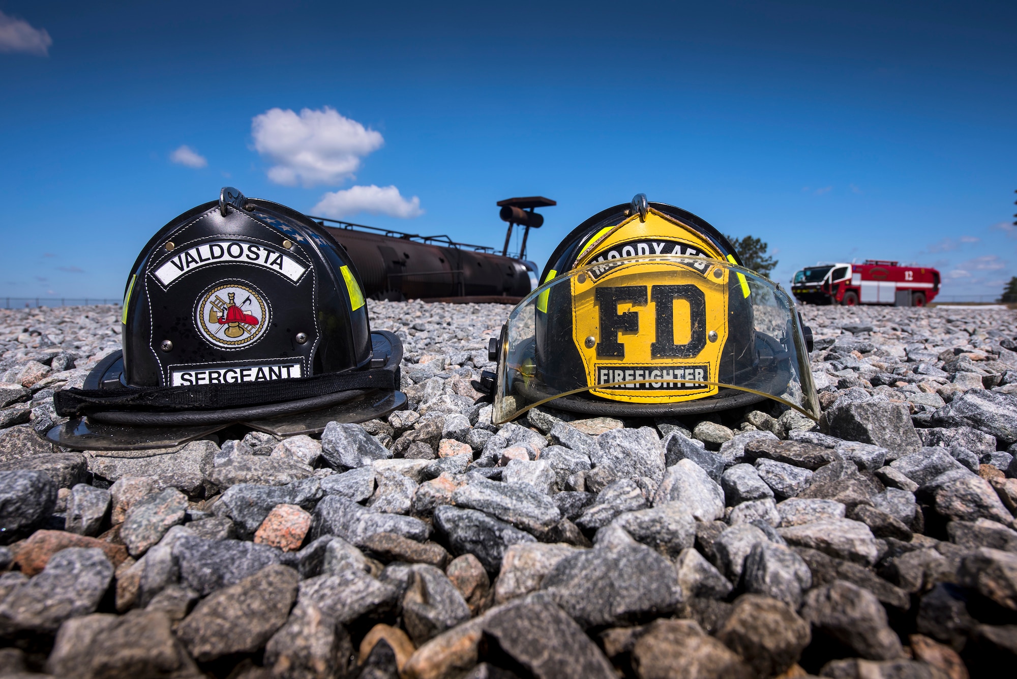 Helmets rest on the ground following live-fire training, April 25, 2018, at Moody Air Force Base, Ga.  Firefighters from the 23d Civil Engineer Squadron and Valdosta Fire Department participated in the training to gain more experience fighting aircraft fires and to work together as a cohesive team while still practicing proper and safe firefighting techniques. (U.S. Air Force photo by Airman Eugene Oliver)