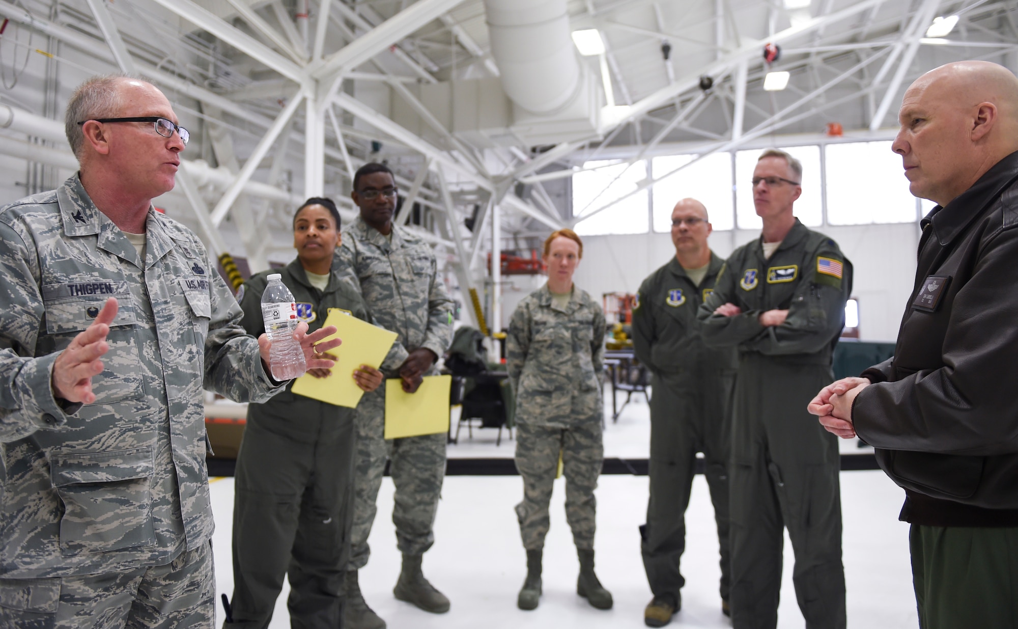 U.S. Air Force Col. Charlie Thigpen, left, deputy director for the Office of the Air Surgeon, talks to Col. Daniel Gabrielli, commander of the 133rd Airlift Wing in St. Paul, Minn., April 20, 2018.