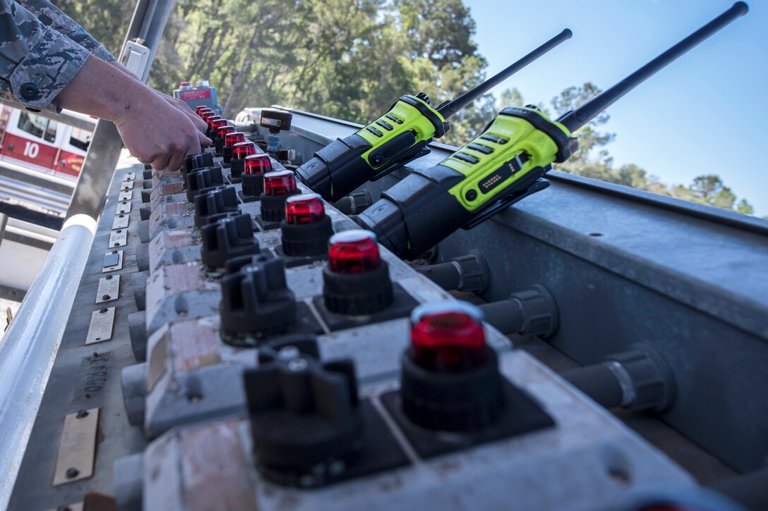 An Airman from the 23d Civil Engineer Squadron (CES) operates an ignition control panel during live-fire training, April 25, 2018, at Moody Air Force Base, Ga. Firefighters from the 23d CES and Valdosta Fire Department participated in the training to gain more experience fighting aircraft fires and to work together as a cohesive team while still practicing proper and safe firefighting techniques. (U.S. Air Force photo by Airman Eugene Oliver)