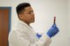 Senior Airman Angel J. Latorre, 514th Aerospace Medicine Squadron medical laboratory technician, processes blood at the McGuire Medical Clinic