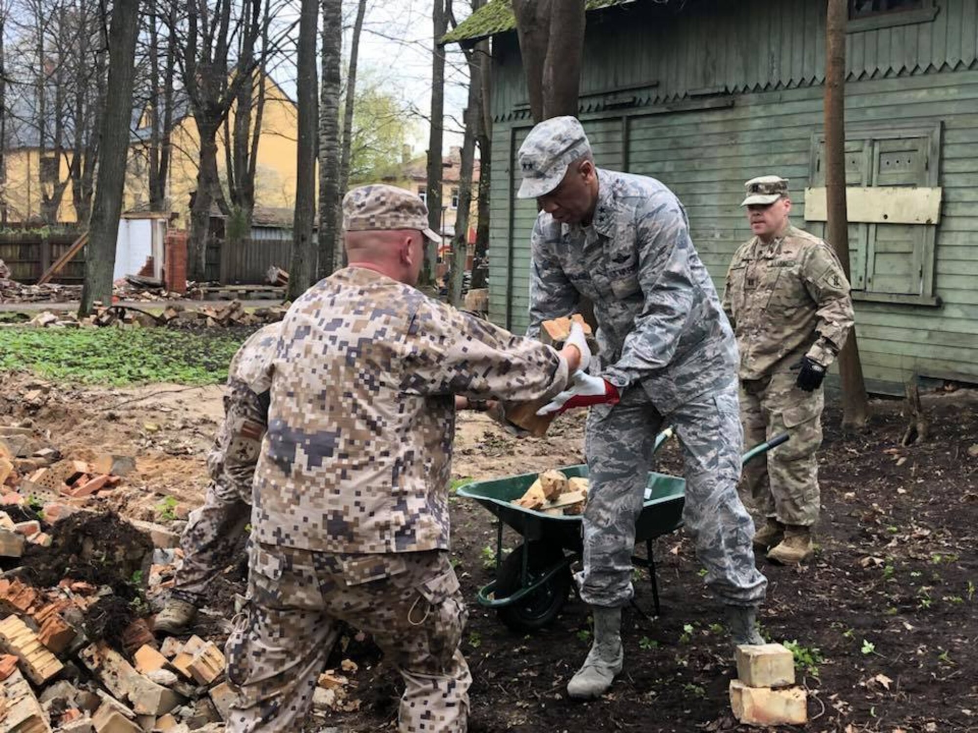 Soldiers and airmen from the Michigan National Guard participate in a volunteer work project at the National Social Care Center, Riga affiliate, as part of Latvia’s “National Clean-up Day,” along with four soldiers from the 407th Civil Affairs Team stationed at Lielvārde Air Base, two personnel from the U.S. Embassy Office of Defense Cooperation, and members of Latvia’s National Guard (Zemessardze) (Michigan National Guard photo by 1st Lt. Andrew Layton/released).