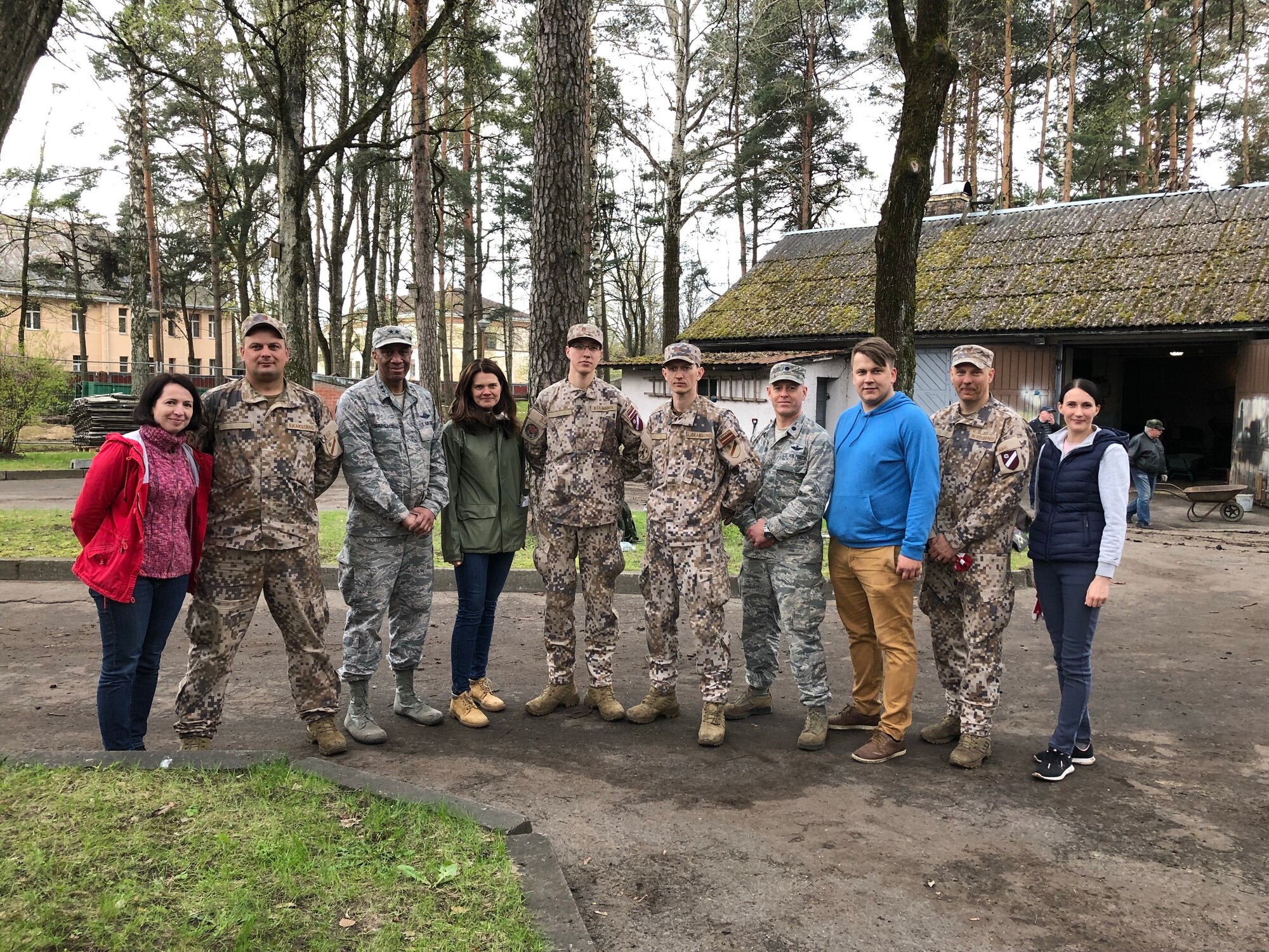 Soldiers and airmen from the Michigan National Guard participate in a volunteer work project at the National Social Care Center, Riga affiliate, as part of Latvia’s “National Clean-up Day,” along with four soldiers from the 407th Civil Affairs Team stationed at Lielvārde Air Base, two personnel from the U.S. Embassy Office of Defense Cooperation, and members of Latvia’s National Guard (Zemessardze) (Michigan National Guard photo by 1st Lt. Andrew Layton/released).