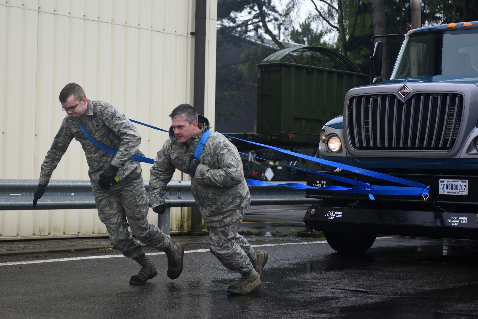 Airmen from the 100th Logistic Readiness Squadron pull a tractor trailer during a ground transportation rodeo at Royal Air Force Lakenheath, England, April 27, 2018. The rodeo offered the opportunity for Airmen from the 48th and 100th LRS the chance to network and compete against their counterparts in a variety of events.(U.S. Air Force photo by Senior Airman Eli Chevalier)