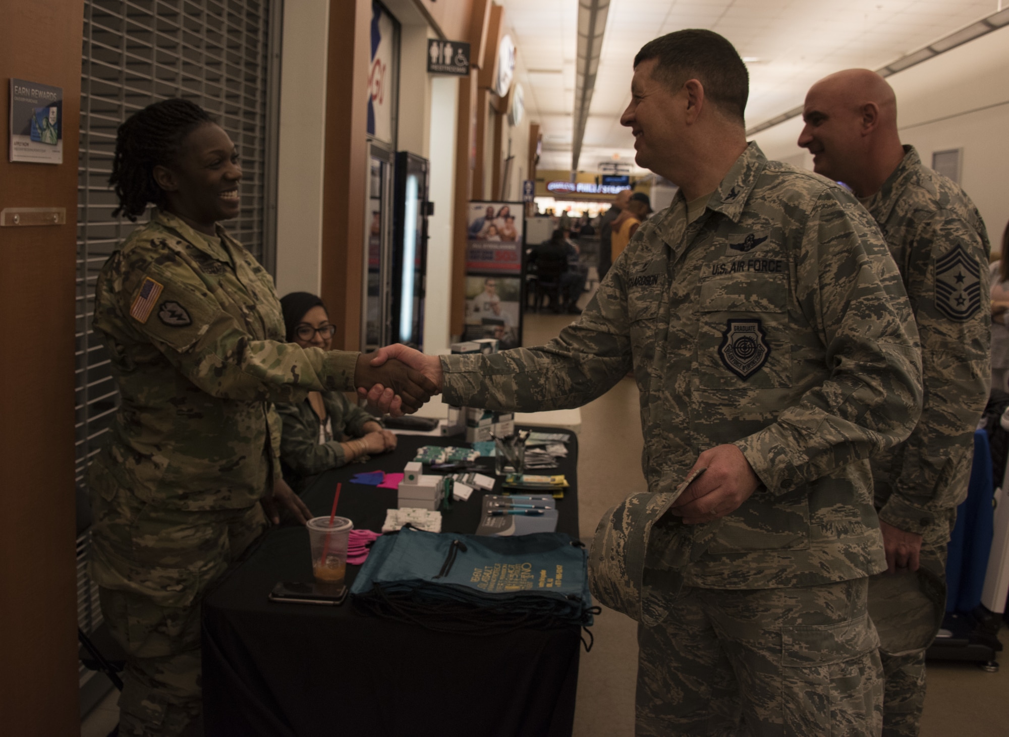 U.S. Air Force Col. Neil R. Richardson, Joint Base McGuire-Dix-Lakehurst and 87th Air Base Wing commander, and Chief Master Sgt. Christopher Yevchak,  87th ABW command chief, introduce themselves to members of different sexual assault awareness and prevention programs at the Health and Wellness Fair at Joint Base MDL, N.J., April 18, 2018. The Health and Wellness Fair is one of many events base leaders attend to get to know their troops and see the work that is accomplished by them. (U.S. Air Force photo by Airman Ariel Owings)